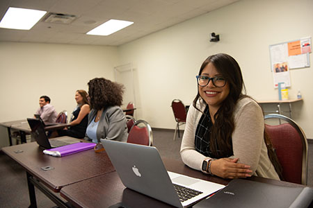 woman smiling with laptop