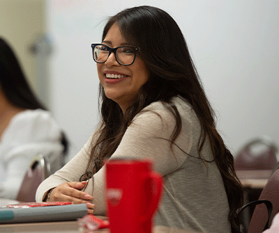Female student smiling in the classroom