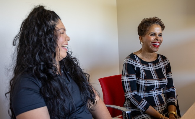 Two students laughing.